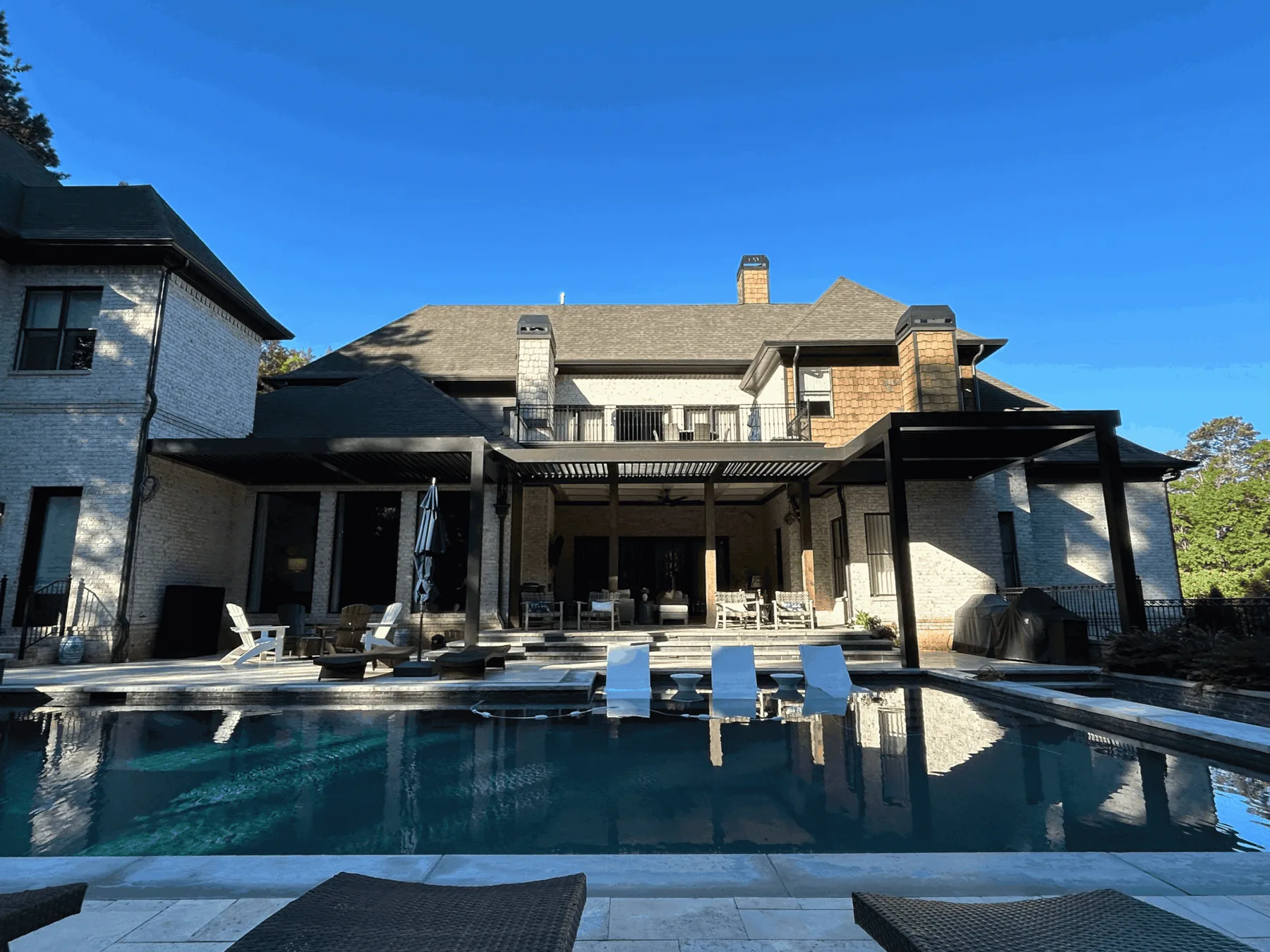 Poolside pergola with wide outdoor deck